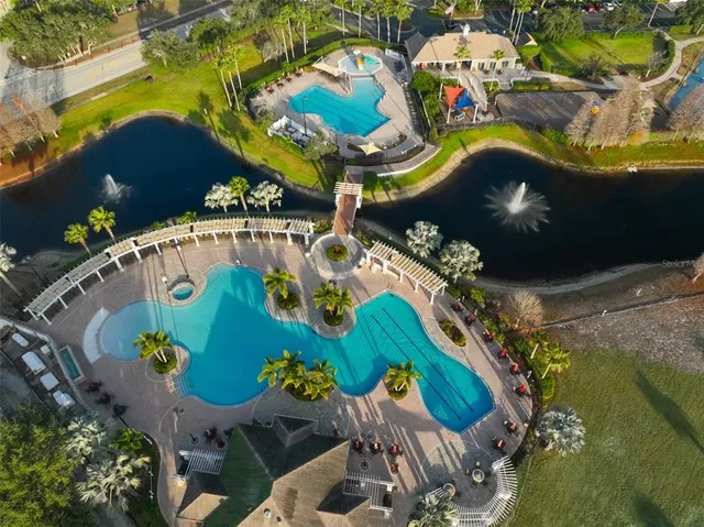 a view of a swimming pool with a lake view