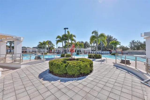 a view of a swimming pool with lounge chairs