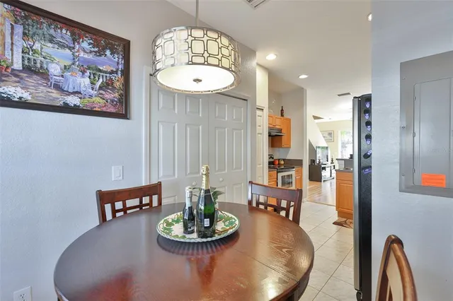 a dining room with furniture and window