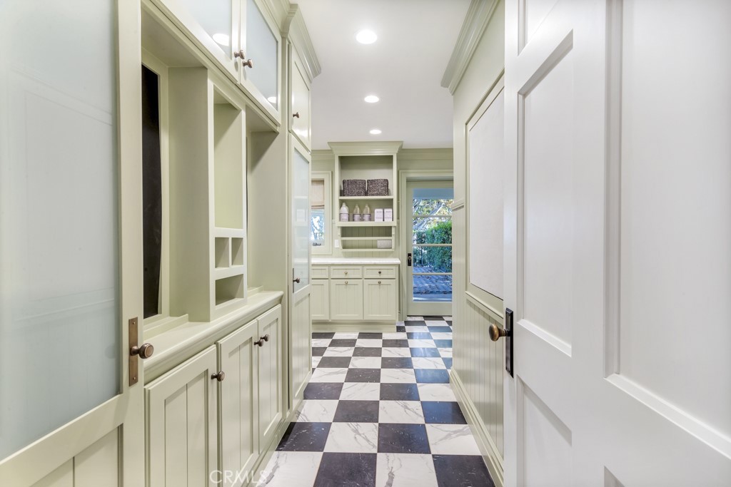 27 Burning Tree Circle Newport Beach, CA 92660 - Photo 24 of 50 a view of a hallway with wooden floor and windows