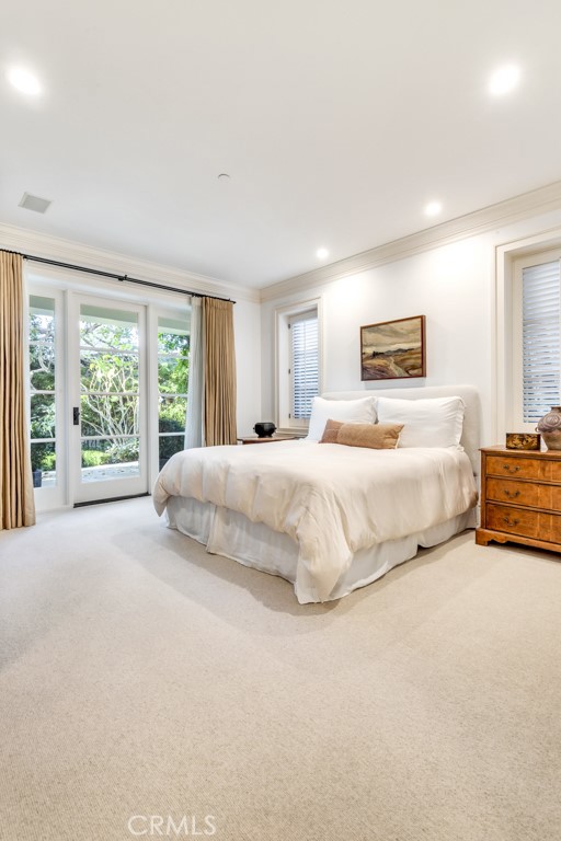 27 Burning Tree Circle Newport Beach, CA 92660 - Photo 28 of 50 a bedroom with a bed painting and a large window