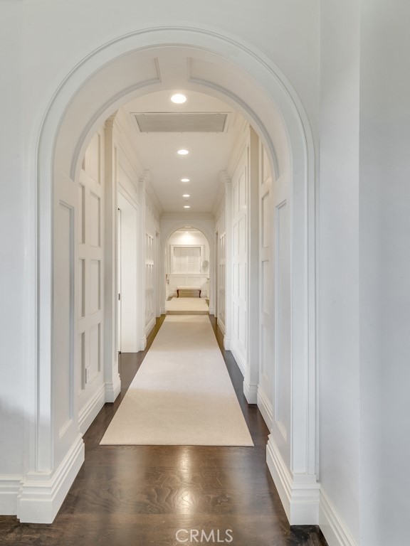 27 Burning Tree Circle Newport Beach, CA 92660 - Photo 34 of 50 a view of a hallway with wooden floor and staircase