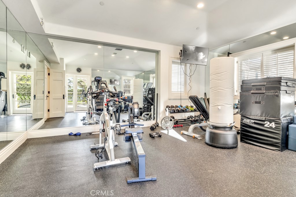 27 Burning Tree Circle Newport Beach, CA 92660 - Photo 39 of 50 a view of a room with gym equipment