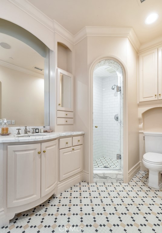 27 Burning Tree Circle Newport Beach, CA 92660 - Photo 41 of 50 a bathroom with a sink a toilet and shower