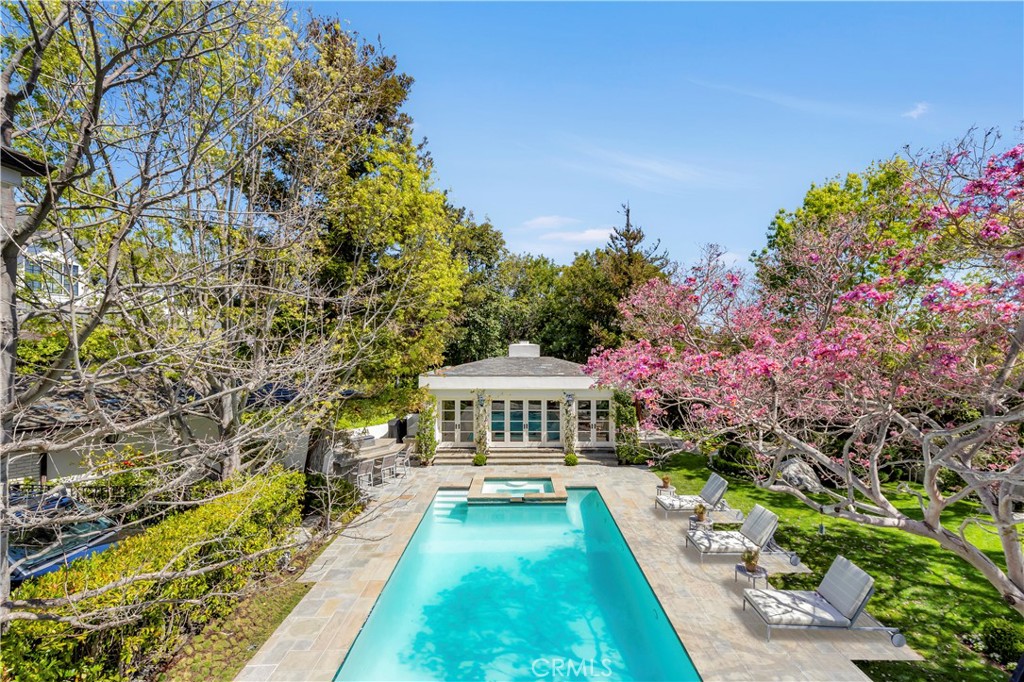 27 Burning Tree Circle Newport Beach, CA 92660 - Photo 42 of 50 a front view of a house with yard