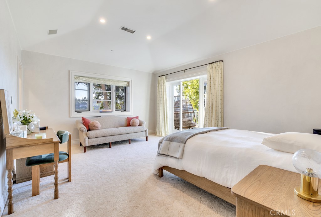 27 Burning Tree Circle Newport Beach, CA 92660 - Photo 43 of 50 a bedroom with a bed and a couch