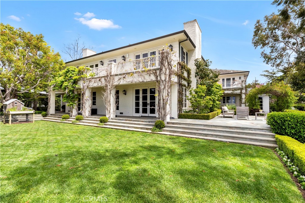 27 Burning Tree Circle Newport Beach, CA 92660 - Photo 5 of 50 a view of a building with a swimming pool