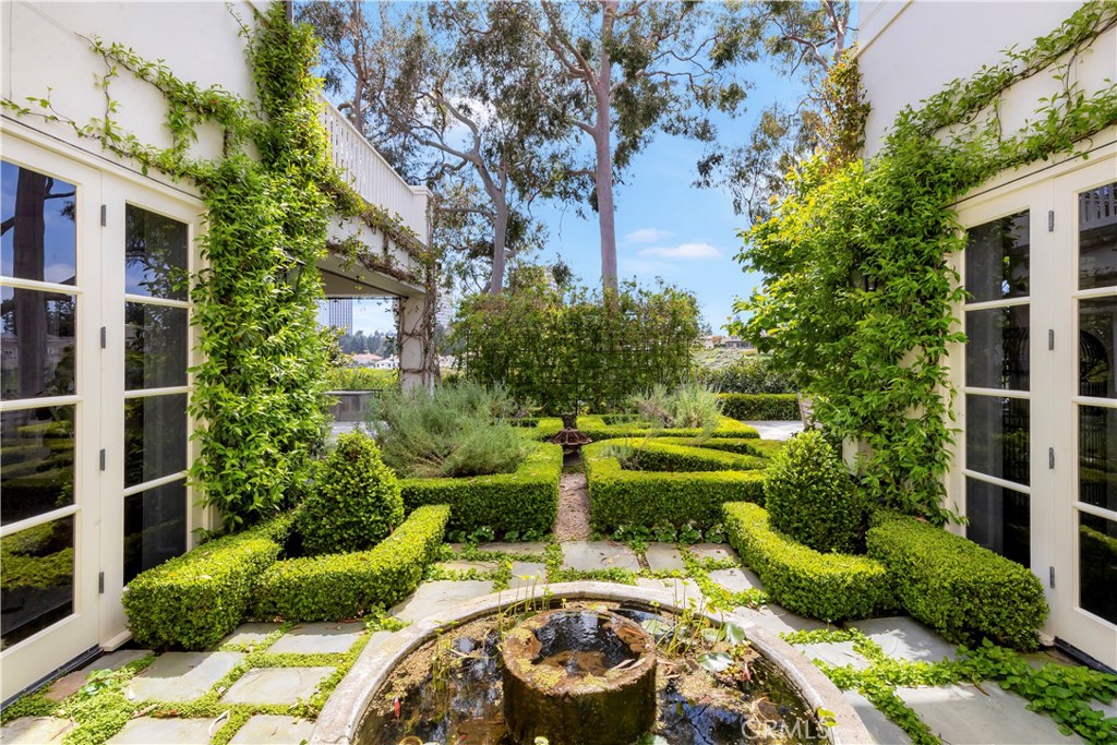 27 Burning Tree Circle Newport Beach, CA 92660 - Photo 8 of 50 a garden view with a seating space