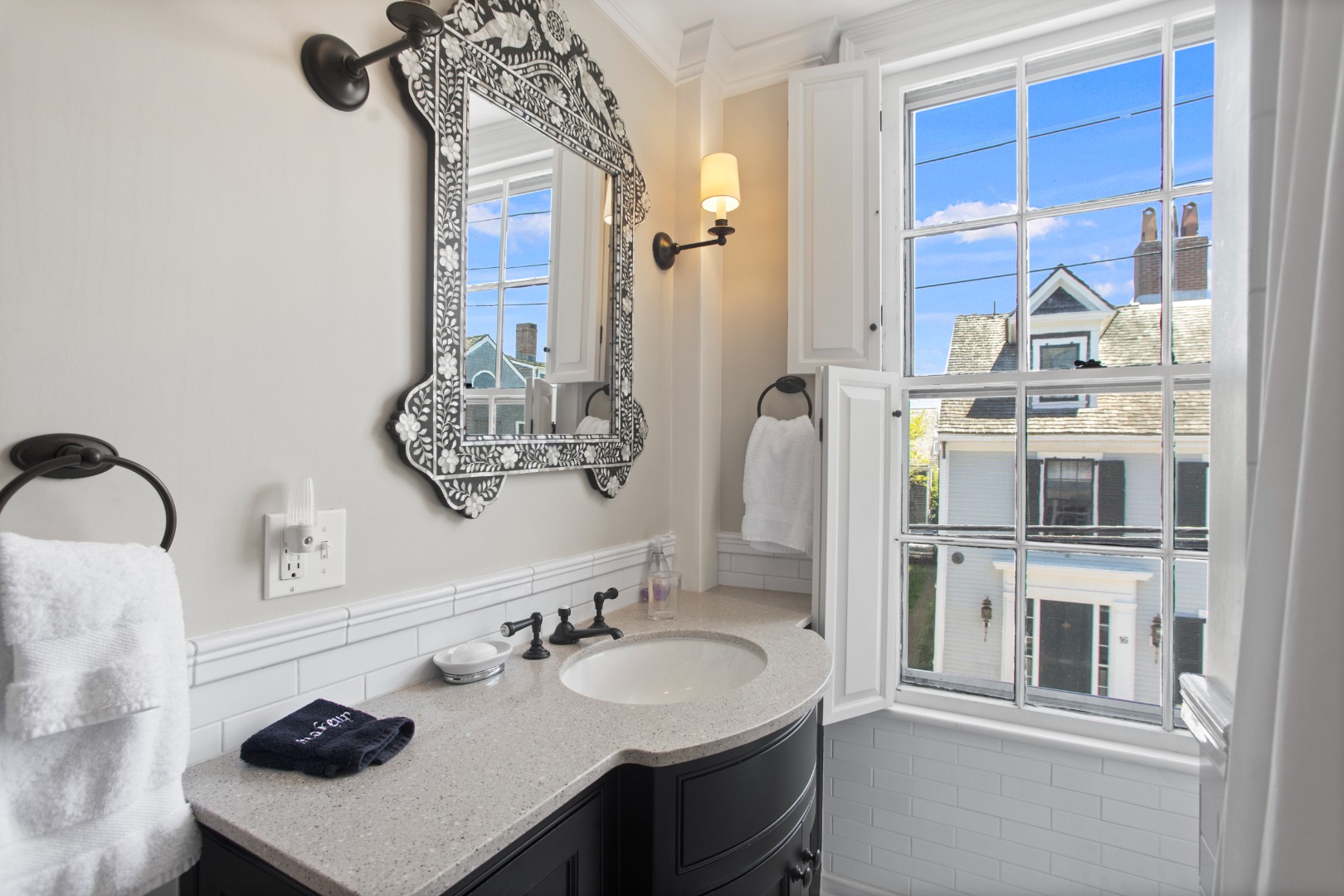 19 Orange Street Nantucket, MA 02554 - Photo 50 of 85 a bathroom with a sink vanity and a mirror