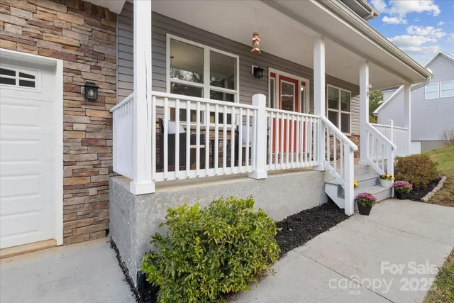 a view of a house with wooden fence