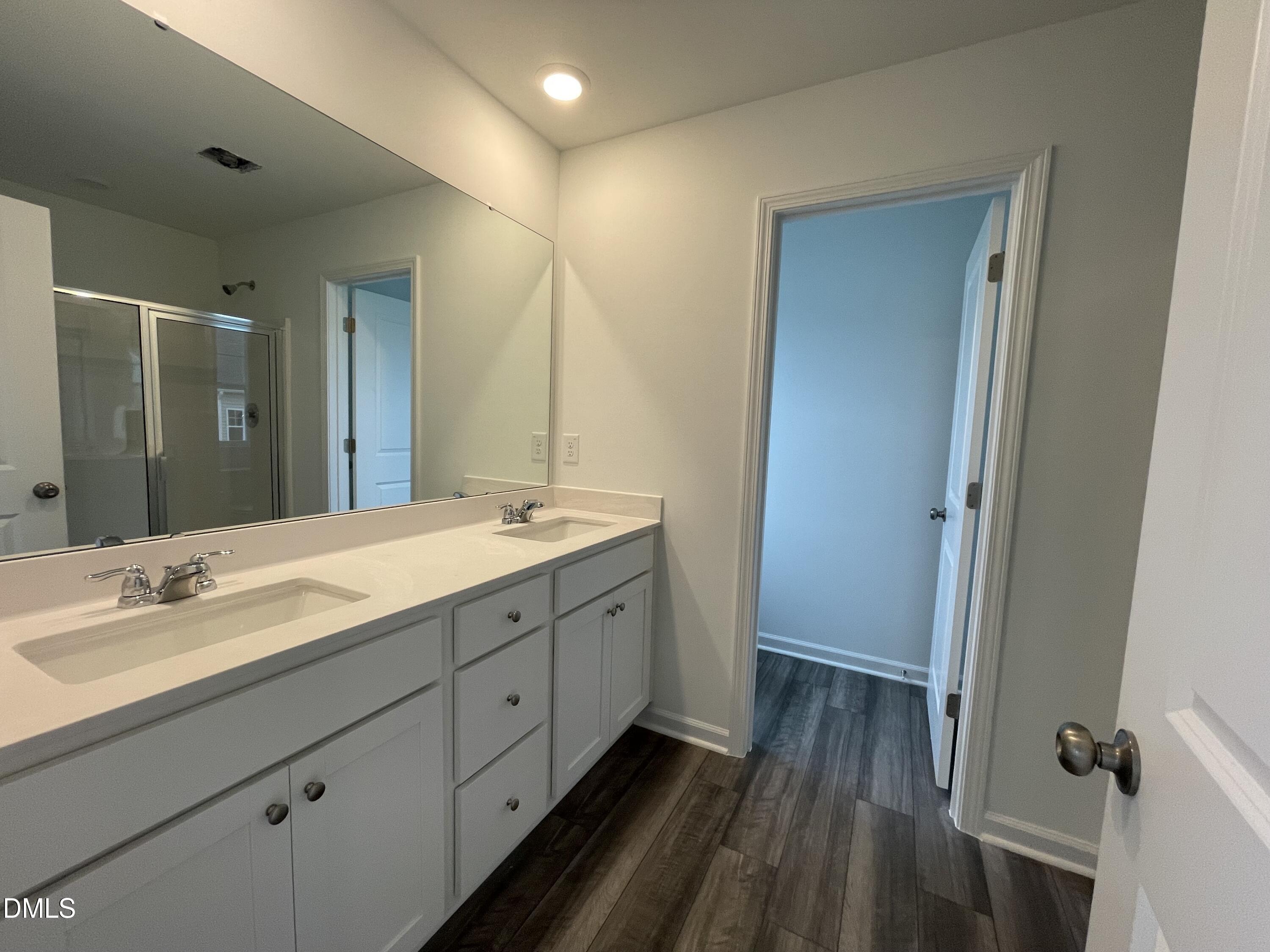 236 Lily Patch Lane Smithfield, NC 27577 - Photo 11 of 46 a spacious bathroom with a double vanity sink and a mirror