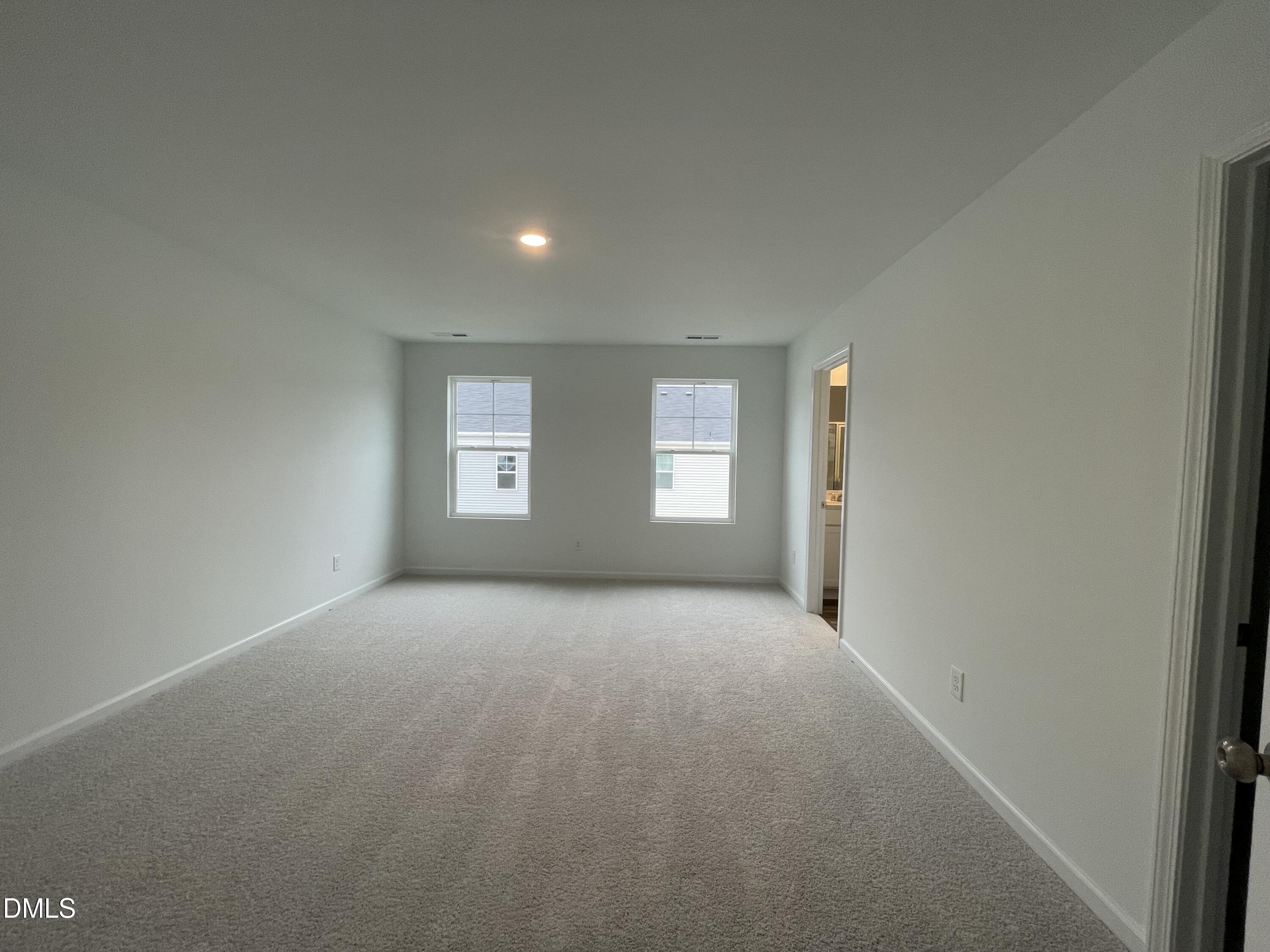 236 Lily Patch Lane Smithfield, NC 27577 - Photo 13 of 46 a view of an empty room with a window