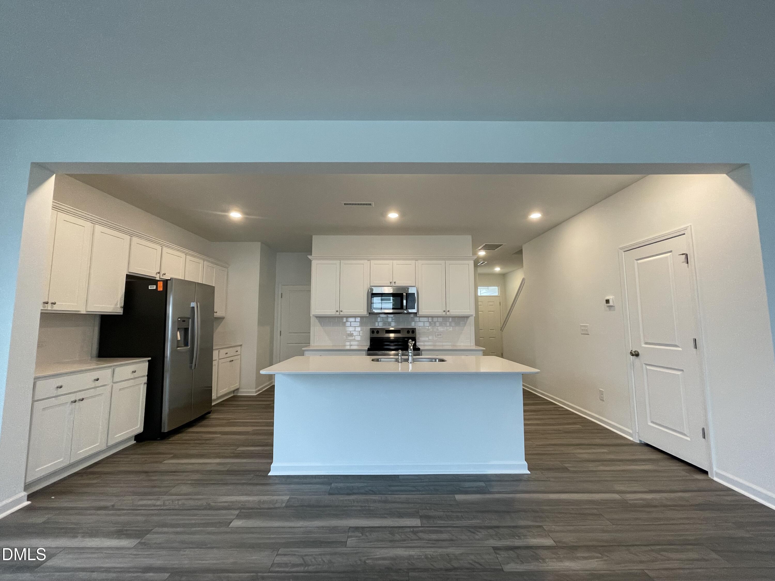 236 Lily Patch Lane Smithfield, NC 27577 - Photo 5 of 46 a view of kitchen with sink microwave and refrigerator