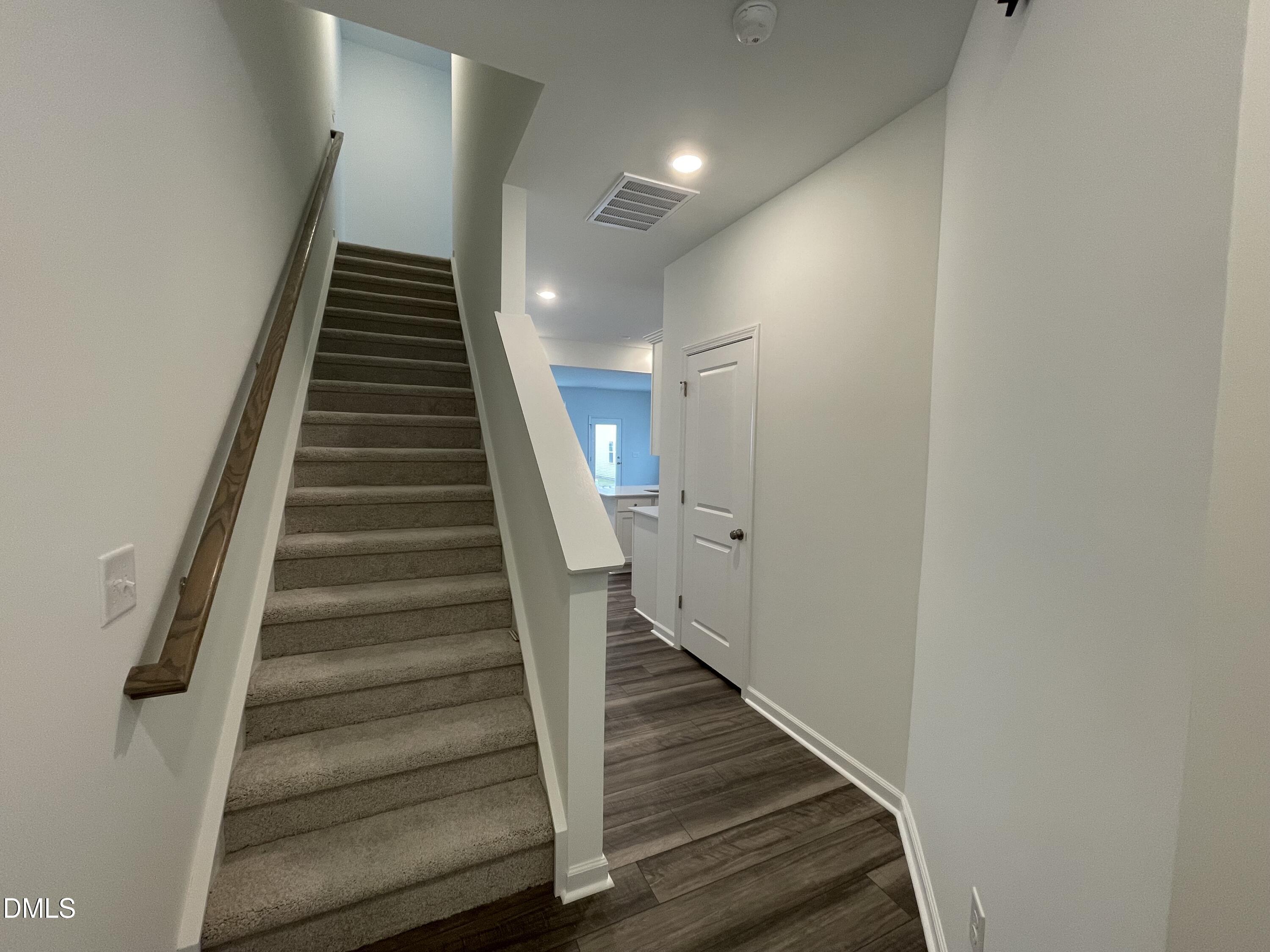236 Lily Patch Lane Smithfield, NC 27577 - Photo 6 of 46 a view of entryway and hall with wooden floor
