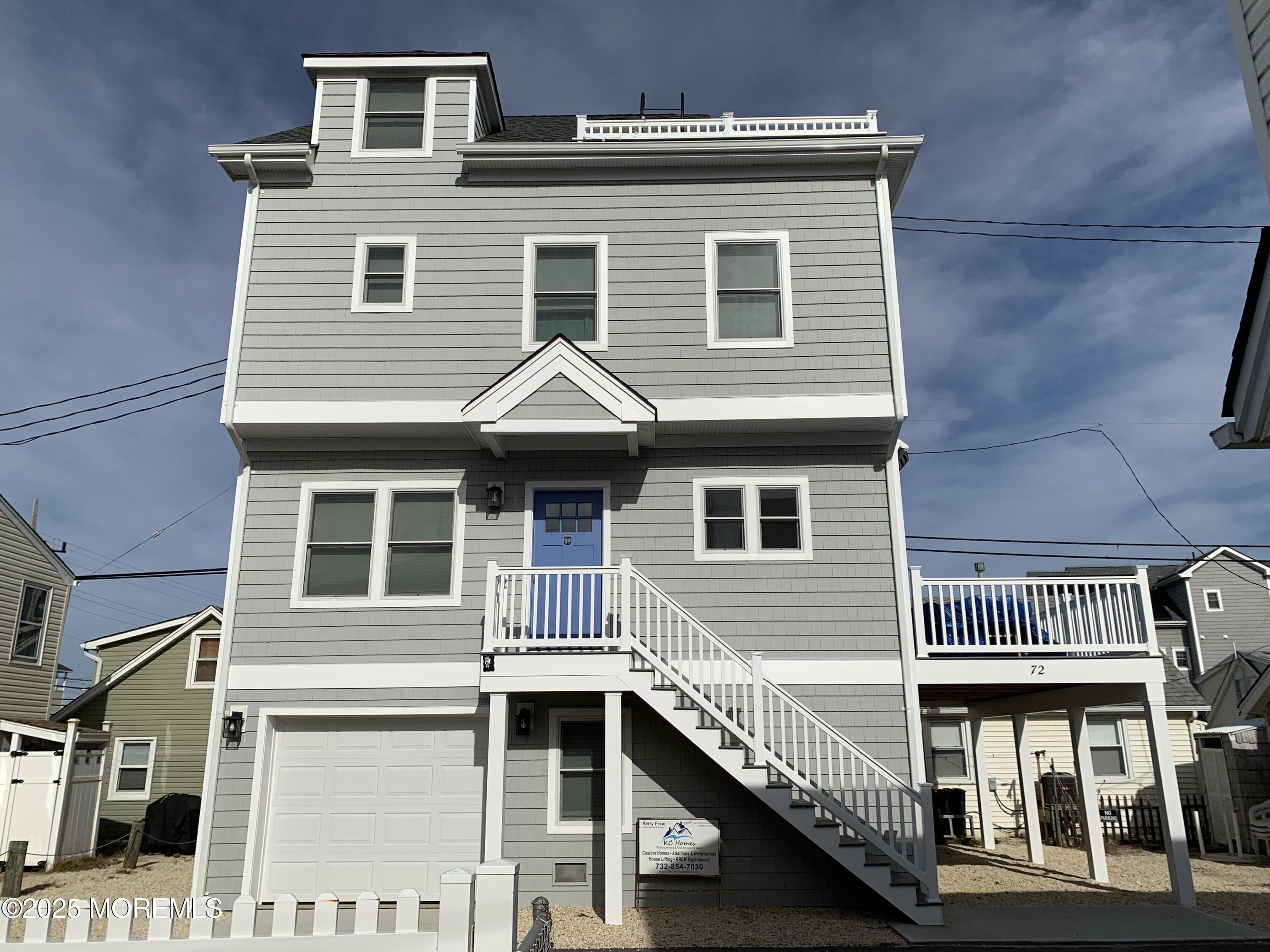 72 Spray Way Lavallette, NJ 08735 - Photo 1 of 14 a front view of a house with balcony