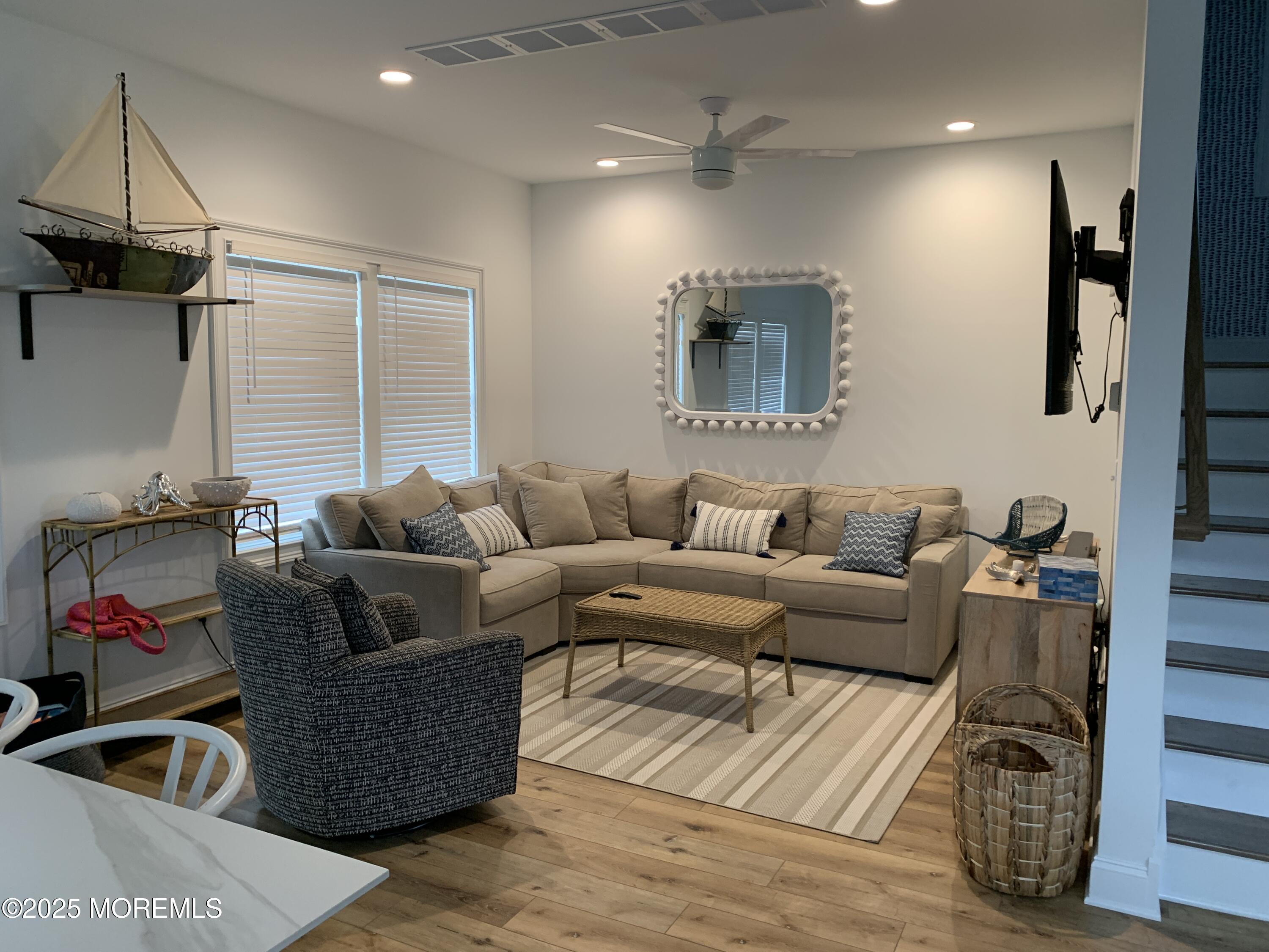 72 Spray Way Lavallette, NJ 08735 - Photo 2 of 14 a living room with furniture and a flat screen tv
