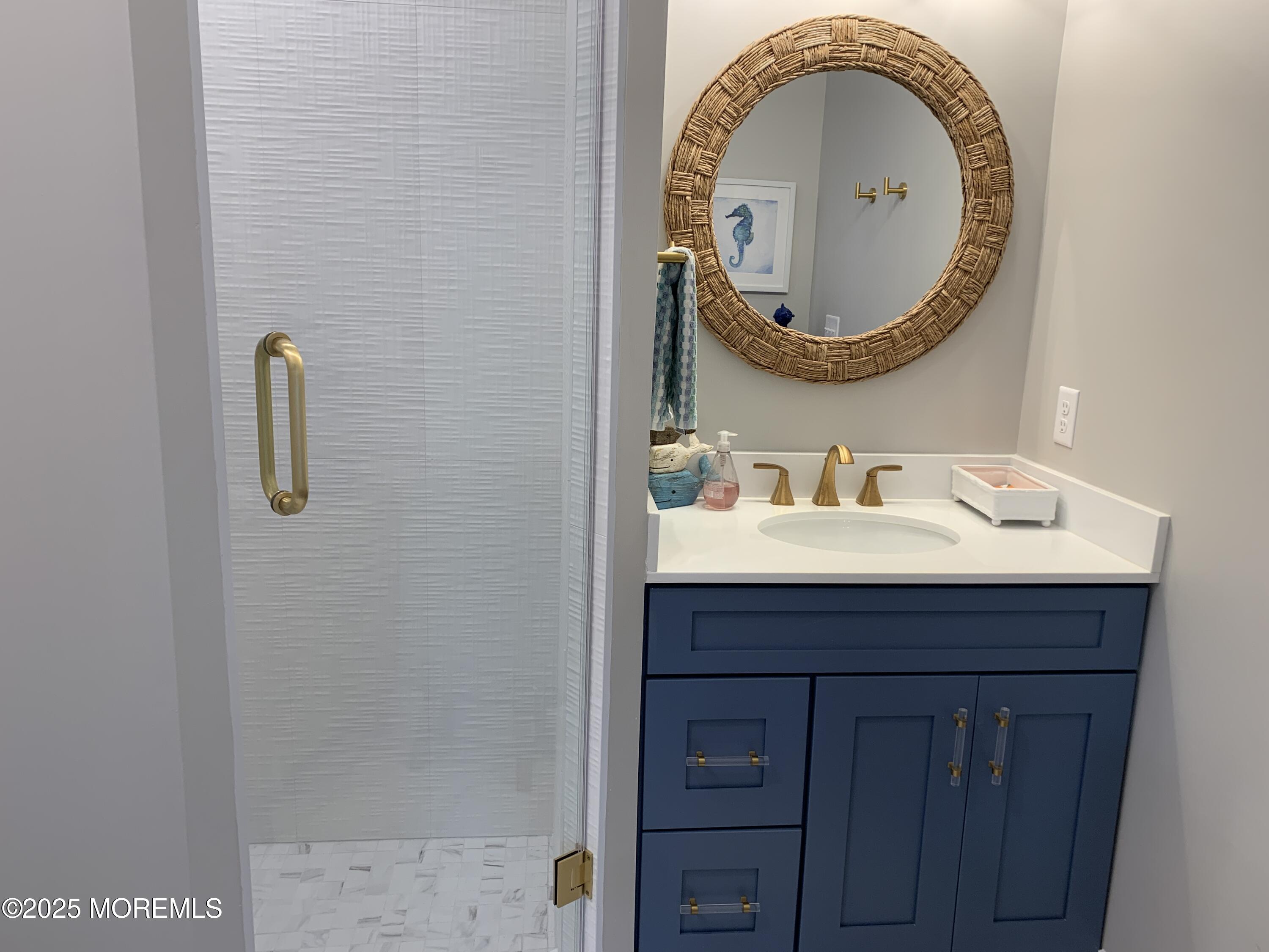 72 Spray Way Lavallette, NJ 08735 - Photo 6 of 14 a bathroom with a sink and a mirror