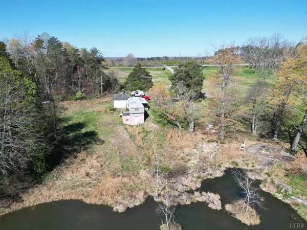 an aerial view of a house with a yard