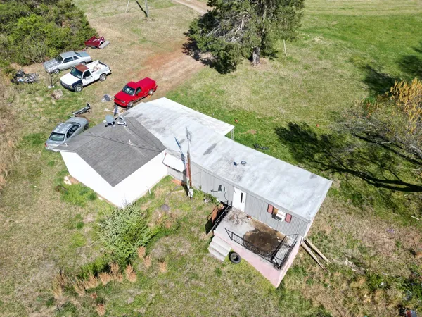 a view of a chairs and table in the patio