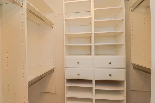a view of an empty walk in closet