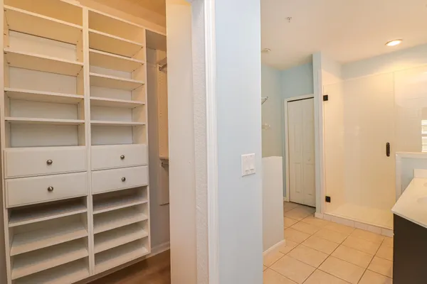 a view of closet area with empty racks