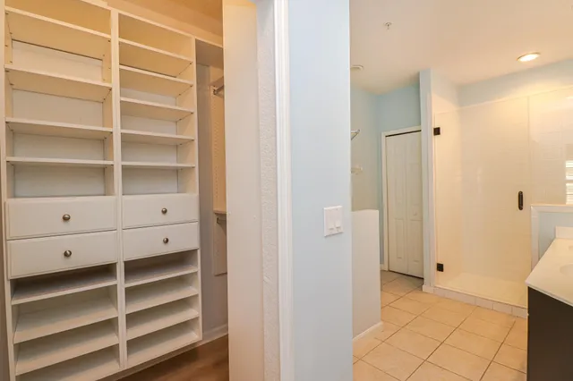 a view of closet area with empty racks