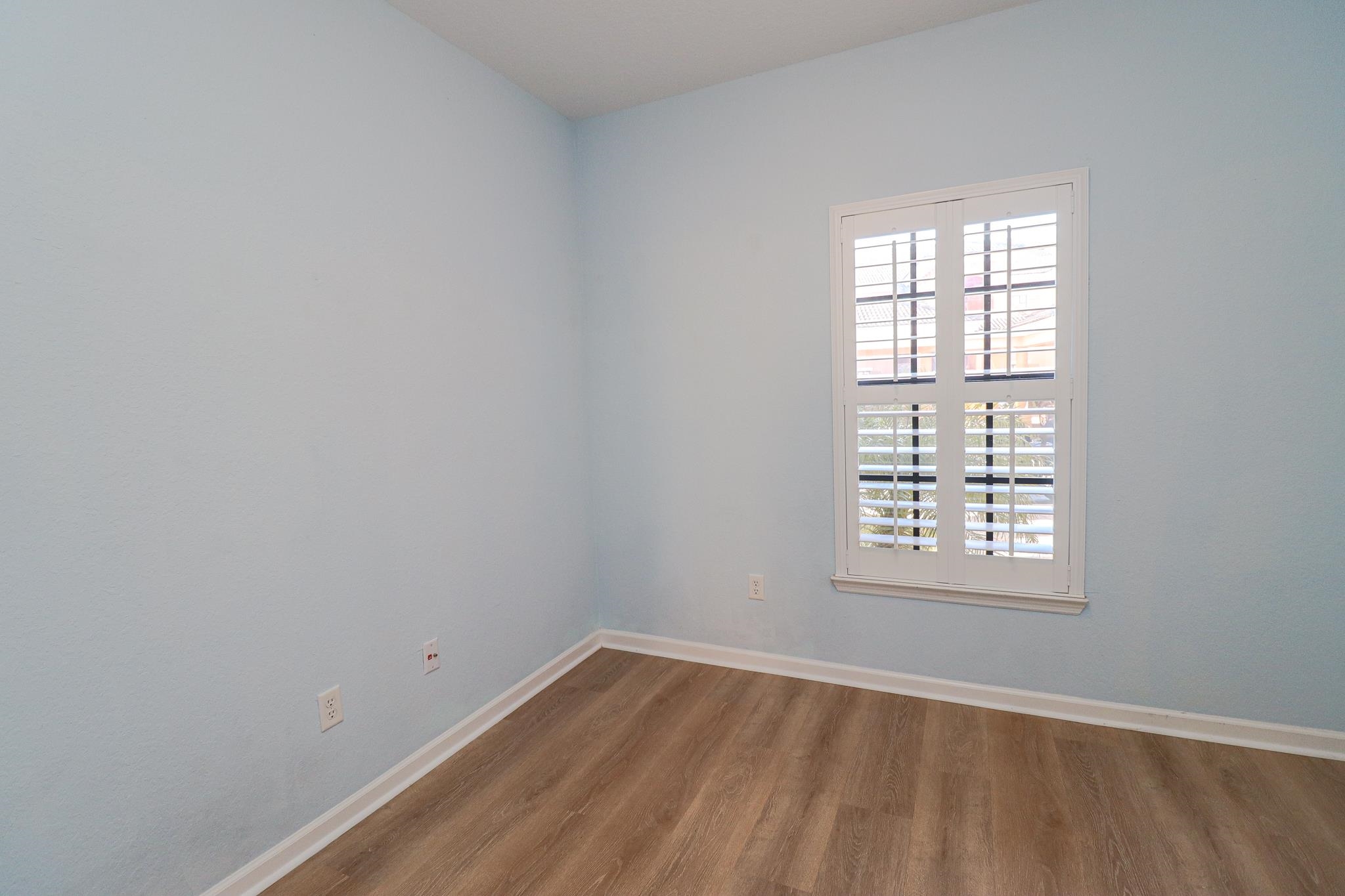 305 Via Castilla, Unit 103 St. Augustine, FL 32095 - Photo 20 of 34 an empty room with a window