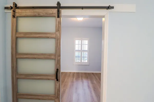 a bathroom with a glass shower door