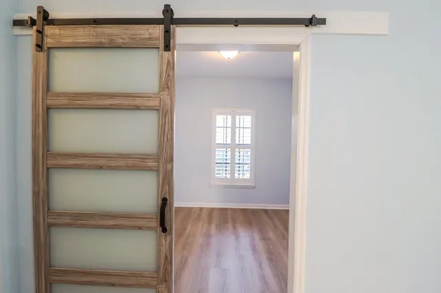 a bathroom with a glass shower door