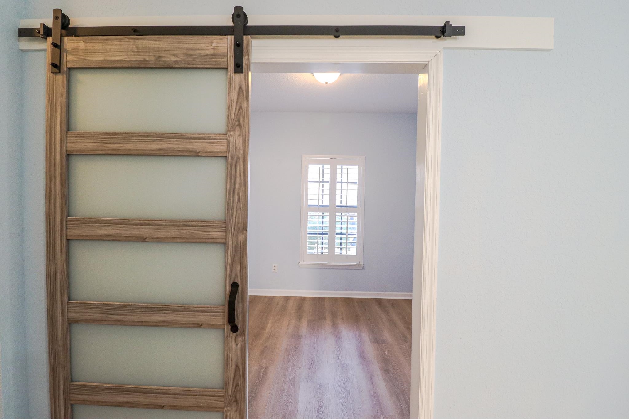 305 Via Castilla, Unit 103 St. Augustine, FL 32095 - Photo 22 of 34 a bathroom with a glass shower door