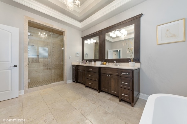122 Walnut Street Elmhurst, IL 60126 - Photo 20 of 41 a bathroom with a sink a mirror and a shower