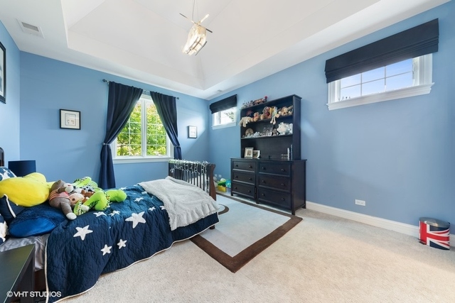 122 Walnut Street Elmhurst, IL 60126 - Photo 22 of 41 a bedroom with a bed window and dresser