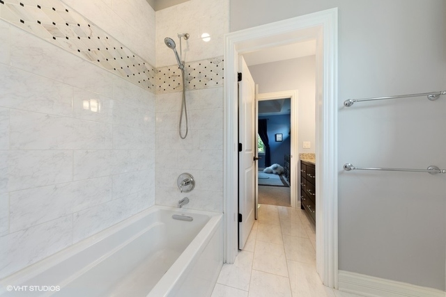 122 Walnut Street Elmhurst, IL 60126 - Photo 23 of 41 a bathroom with a bathtub and a shower