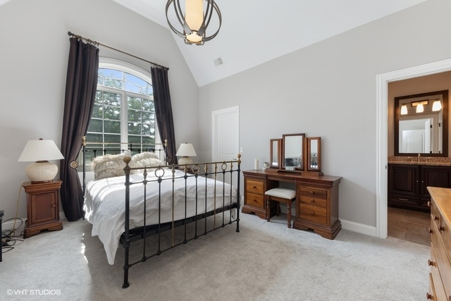 122 Walnut Street Elmhurst, IL 60126 - Photo 25 of 41 a bedroom with a bed table and window