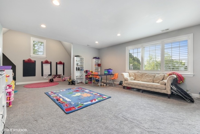 122 Walnut Street Elmhurst, IL 60126 - Photo 27 of 41 a living room with furniture and a large window