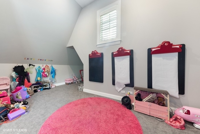 122 Walnut Street Elmhurst, IL 60126 - Photo 28 of 41 a bedroom with bed and a large mirror