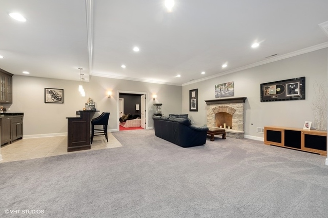 122 Walnut Street Elmhurst, IL 60126 - Photo 30 of 41 a living room with furniture and a fireplace