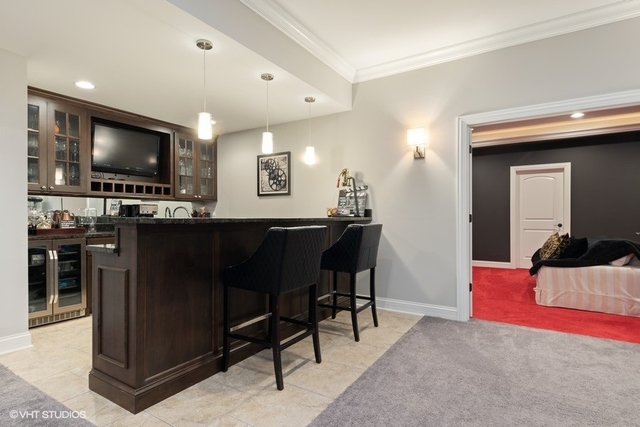 122 Walnut Street Elmhurst, IL 60126 - Photo 33 of 41 a living room with furniture and a flat screen tv