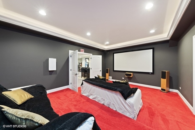 122 Walnut Street Elmhurst, IL 60126 - Photo 35 of 41 a bedroom with a bed and a flat screen tv