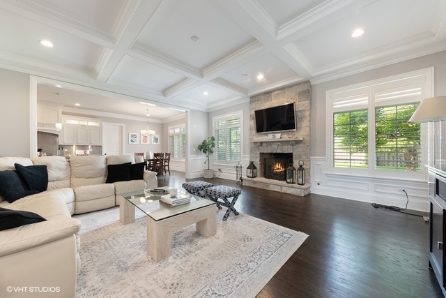 122 Walnut Street Elmhurst, IL 60126 - Photo 6 of 41 a living room with fireplace furniture and a wooden floor