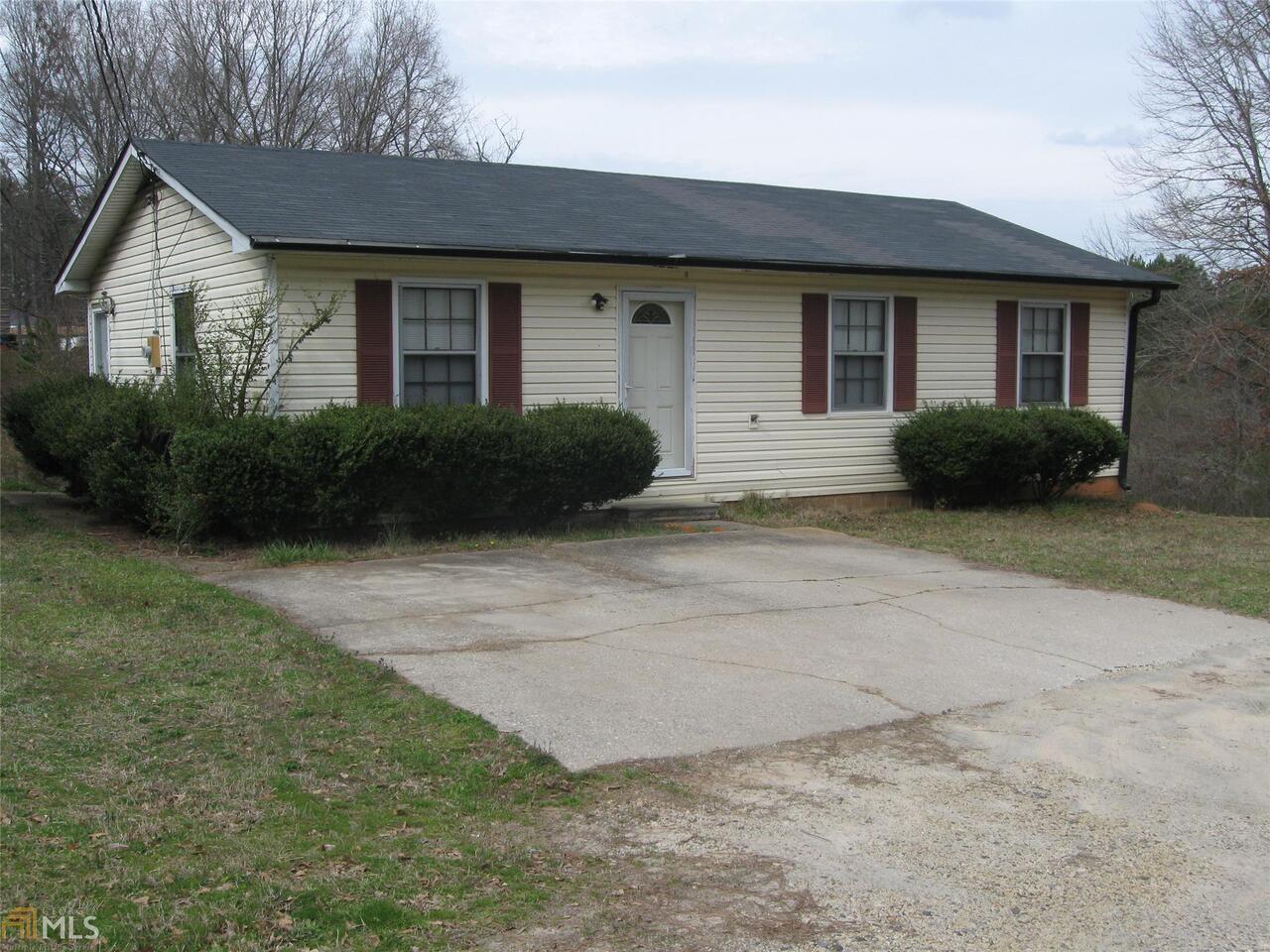 138 Pinecrest Road Southeast Winder, GA 30680 - Photo 1 of 1 a view of a brick house with a yard