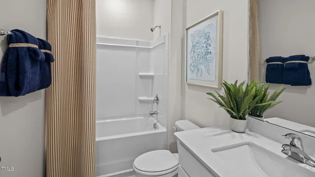 a bathroom with a sink a toilet a shower and a bathtub