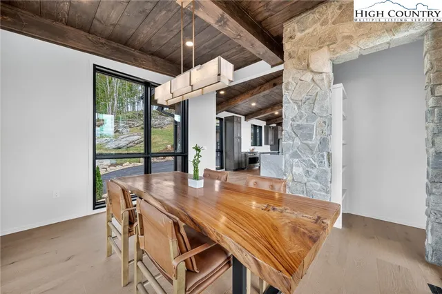 a kitchen with stainless steel appliances wooden cabinets a stove and a refrigerator