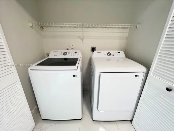 a utility room with dryer and washer
