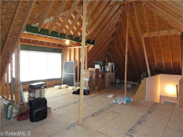5411 Effieham Street Oak Ridge, NC 27310 - Photo 14 of 16 Other. The walk up attic is poised to be additional finished space. three large windows overlook the rear yard and abundant space and ceiling height abound. Sellers simply use it as accessible walk up storage space.