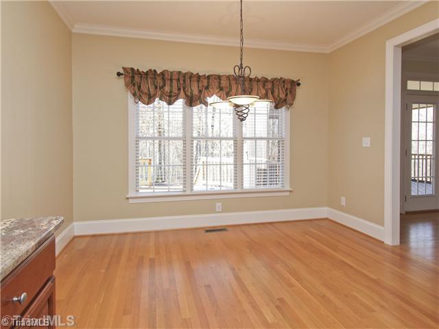 5411 Effieham Street Oak Ridge, NC 27310 - Photo 6 of 16 Breakfast. Breakfast area off of the kitchen with views of the rear yard.