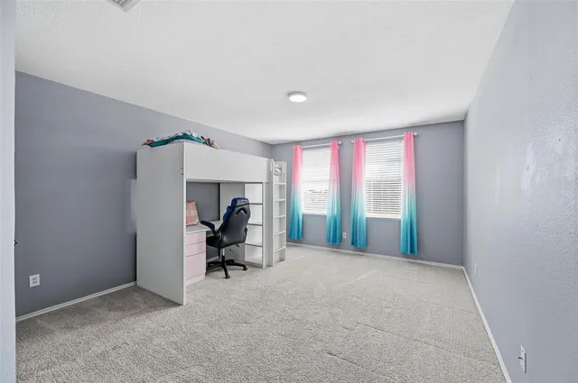 a view of a room with window and cabinet