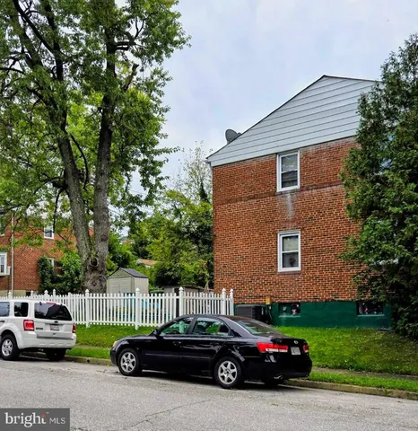 a car parked in front of a house
