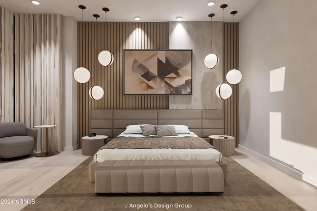 a bedroom with a bed and painting on the wall