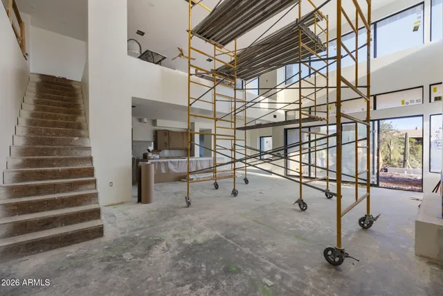 a bed room with a bed and a chandelier